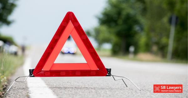 A warning triangle set out on the roadside. SB Lawyers can help with your road traffic accident compensation